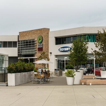 ABBOTSFORD, CANADA - JUNE 9, 2019: Shopping mall in city center with shops banks and parking lotsのeditorial素材