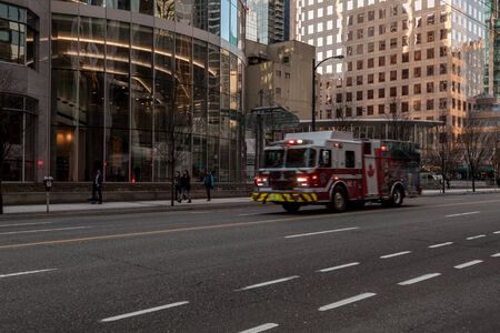 VANCOUVER, CANADA - FEBRUARY 19, 2020: fire truck on street in downtown.のeditorial素材