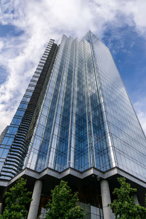 BURNABY, CANADA - JUNE 19, 2019: look up to tall buildings with blue sky in downtown