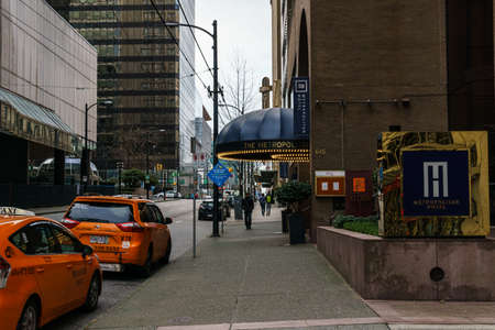VANCOUVER, CANADA - FEBRUARY 2, 2020: taxi cars near metropolitan hotel in downtown