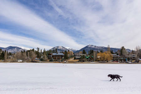 INVERMERE, CANADA - MARCH 17, 2020: frozen Windermere lake and rocky mountains in british columbia canadaのeditorial素材