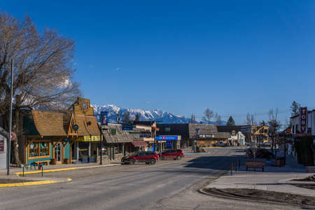 INVERMERE, CANADA - MARCH 18, 2020: main street in small town with bank and cars british columbiaのeditorial素材