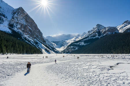 LAKE LOUISE, CANADA - MARCH 20, 2020: rocky mountains around frozen lake louise winter wonderlandのeditorial素材