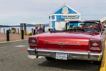 SIDNEY, CANADA - JULY 14, 2019: Classic convertible red Ford on the streetのeditorial素材