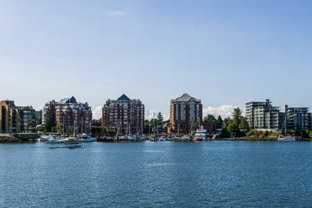 VICTORIA, CANADA - JULY 14, 2019: busy harbor at downtown area with yachts and sea plane.のeditorial素材