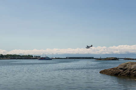 VICTORIA, CANADA - JULY 14, 2019: water entrance to the city near james bay with white clouds and...