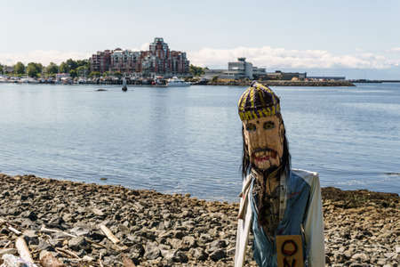 VICTORIA, CANADA - JULY 14, 2019: wood carving guard on the shoreのeditorial素材