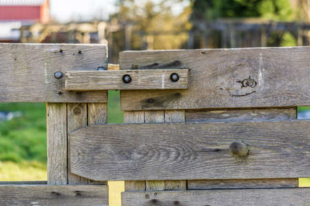 part of old farm gate closeup with blurry background
