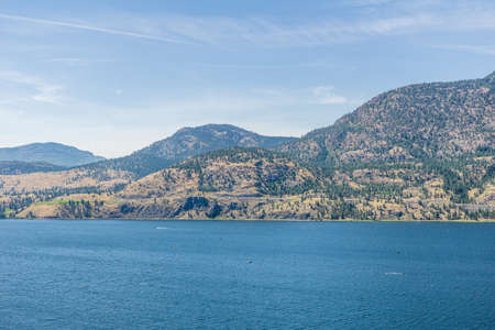 Skaha lake view at summer time with blue sky british columbia canadaの写真素材