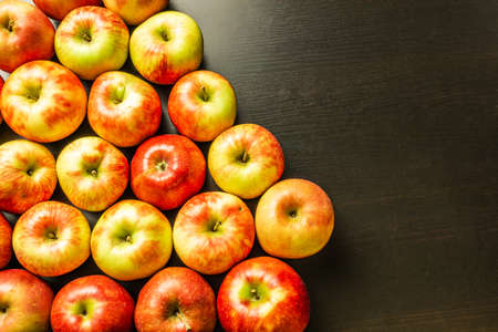 Fresh apples on a dark wooden background.の写真素材