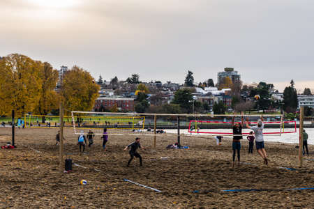 VANCOUVER, CANADA - NOVEMBER 21, 2020: people playing beach volleyball in kitsilano autumn dayのeditorial素材