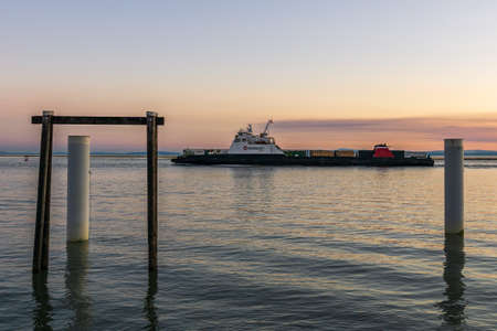 RICHMOND, CANADA - SEPTEMBER 10, 2020: seaspan ferry on the Fraser River sunset time in British Columbia Canadaのeditorial素材