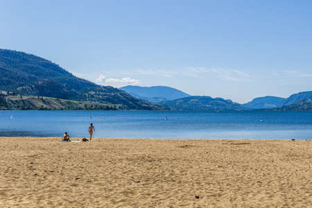 Sudbury Beach and Skaha Lake British Columbia with white clounds on sky.の写真素材