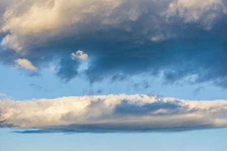 Blue sky with white clouds abstract background or textureの写真素材
