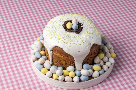Traditional Easter cake or sweet bread and eggs decorated with homemade pastry.
