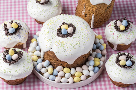 several traditional Easter cakes or sweet bread and candy eggs decorated homemade pastry top view.の写真素材
