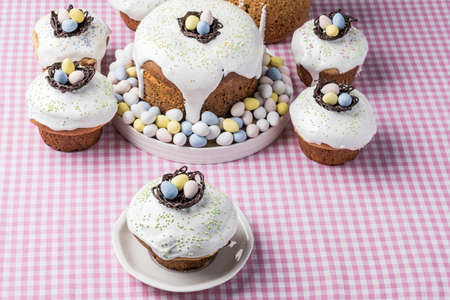 several traditional Easter cakes or sweet bread and candy eggs decorated homemade pastry top view.の写真素材