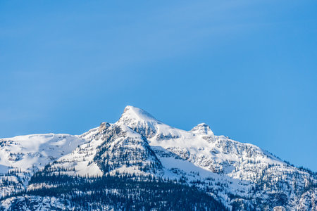 high mountains with snow on top clear blue sky British Columbia Canada.の写真素材
