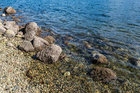 top view of sea waves and rocks on the beach British Columbia Canada.の写真素材