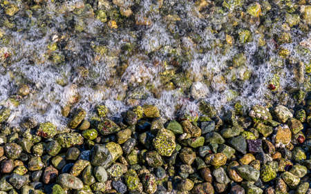 top view of sea waves and rocks on the beach British Columbia Canada.の写真素材