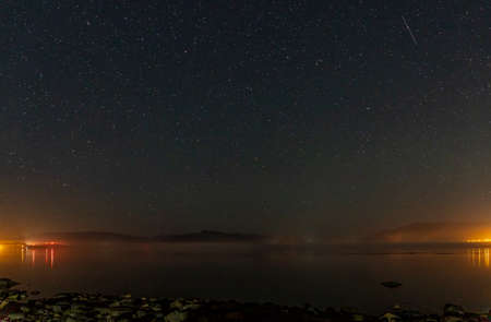 Night sky filled with galaxy stars dark blue space backgroundの写真素材