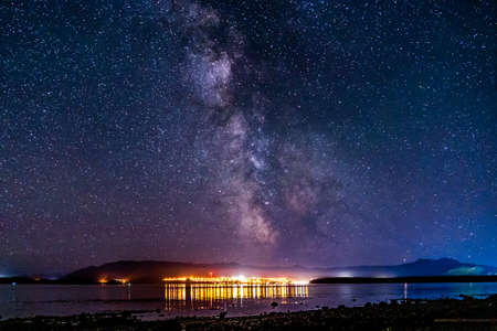 night view to small town at Mount Waddington many stars on dark skyの写真素材