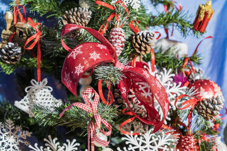 a lot of things on the decorated Christmas tree new year decoration background celebrate winter season.の写真素材