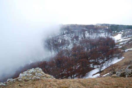 Little fog in brown Crimean mountains. Spring.