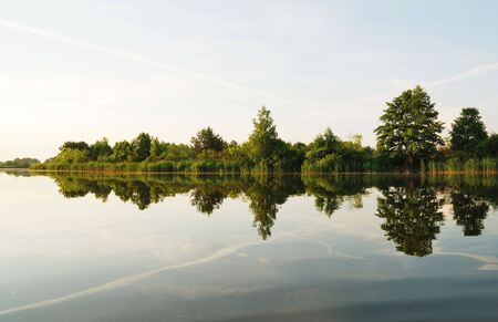 Beautiful green and blue day river landscapeの写真素材