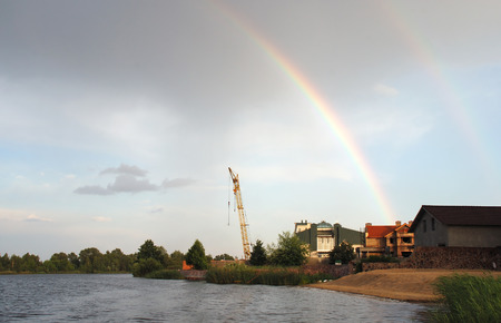 Rainbow under river Kozinka near Kiev, Ukraine. After rain.の写真素材