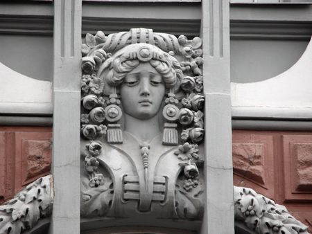 Grey female sculpture face decorated pink wall of ancient mansionの写真素材