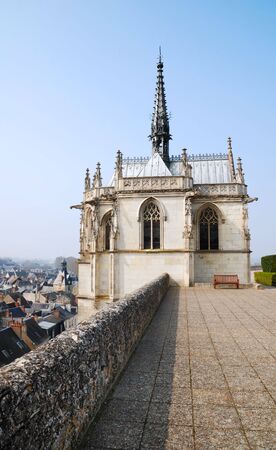 Chapel of Saint Hubert against roofs and blue skyの写真素材
