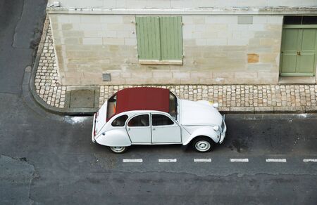 Street scene with vintage car in old European town