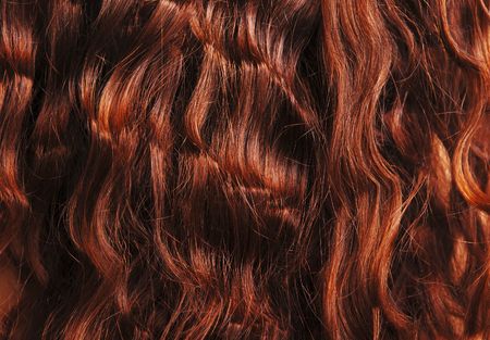 Close-up of red curly hair, hairdressing backgroundの写真素材
