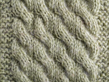 Knitted cloth is made by hand. It is decorated with bulging pattern.