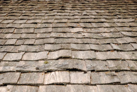 Old shingle roof is photographed closely.の写真素材