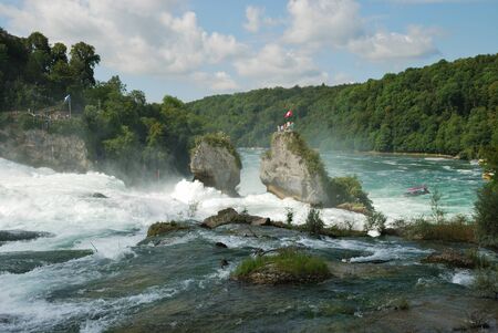 The Rhine Falls is the largest plain waterfall in Europe. It is located on the Upper Rhine near the town of Neuhausen in northern Switzerland.の写真素材