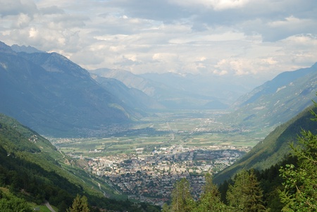 The small town of Martigny is located on the Rhone elbow in the Swiss Alps  It is surrounded by vineyards and orchards  の写真素材