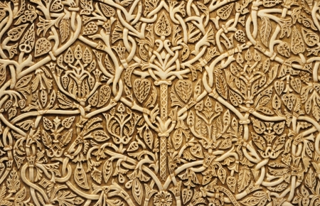 Floral pattern is made on the ivory bone  The ancient scrimshaw is photographed close-up 