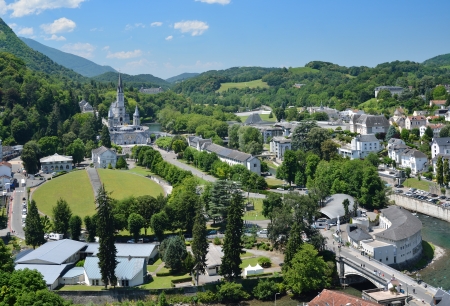 Lourdes is a major place of Roman Catholic pilgrimage and of miraculous healings  It is a small market town lying in the foothills of the Pyrenees の写真素材