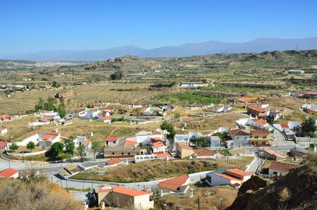 Guadix occupies part of an elevated plateau among the northern foothills of the Sierra Nevada. It is famous for its cave houses in the tufa rocks of Barrio de Santiago.の写真素材