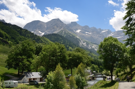 A road goes along the river Gave of Pau from the village to falls of the cirque of Gavarnieの写真素材