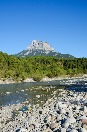 The Cinca river flows through the Spanish Pyrenees  In the background there is the Pena Montanesa  conspicuous rocky mountainous outcrop  の写真素材