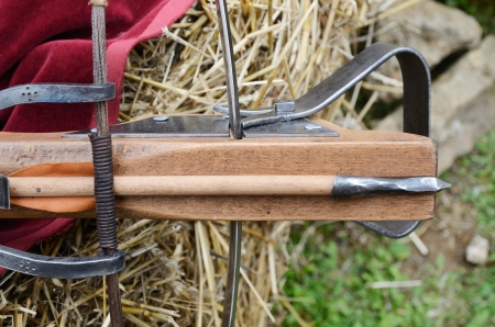 A vintage crossbows with a bolt are photographed close-up の写真素材