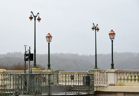The Boulevard of Pyrenees is photograped in winter. There is nobody in the empty terrace with...