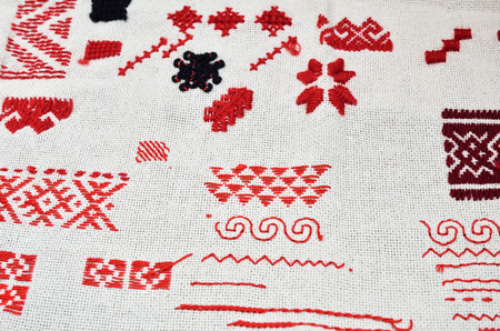 Various types of embroidery are made by hand on the modern linen textile.の写真素材