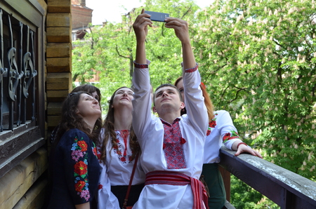 Kyiv Ukraine  May 24 2015: People in Ukrainian folk dress take a selfie at Mega march of...