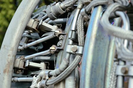 Details of the airplane's engine are photographed closely with selective focus.