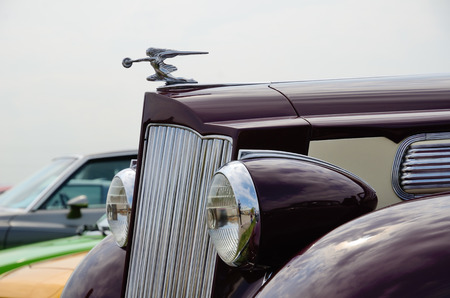 The hood with the woman-like figurine of the old-fashioned automobile Packard