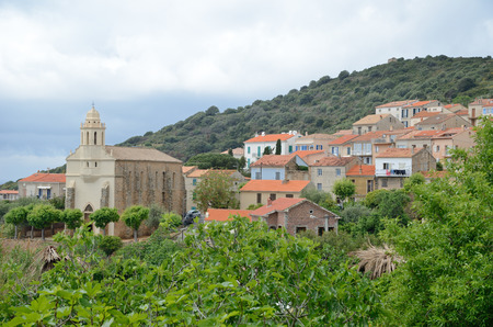 Cargese is an attractive town on the rocky promontory overlooking a deep blue bay.の写真素材